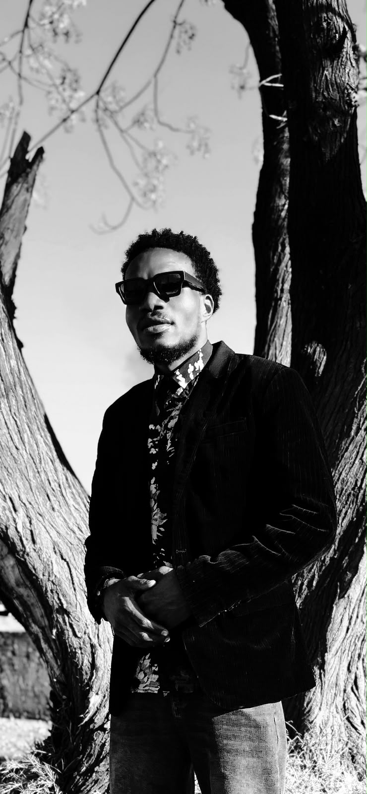 Black-and-white portrait of Mula Jay outdoors